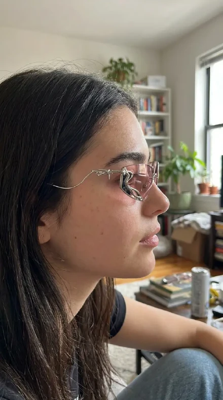 UGC shoppable image of a creator wearing product glasses